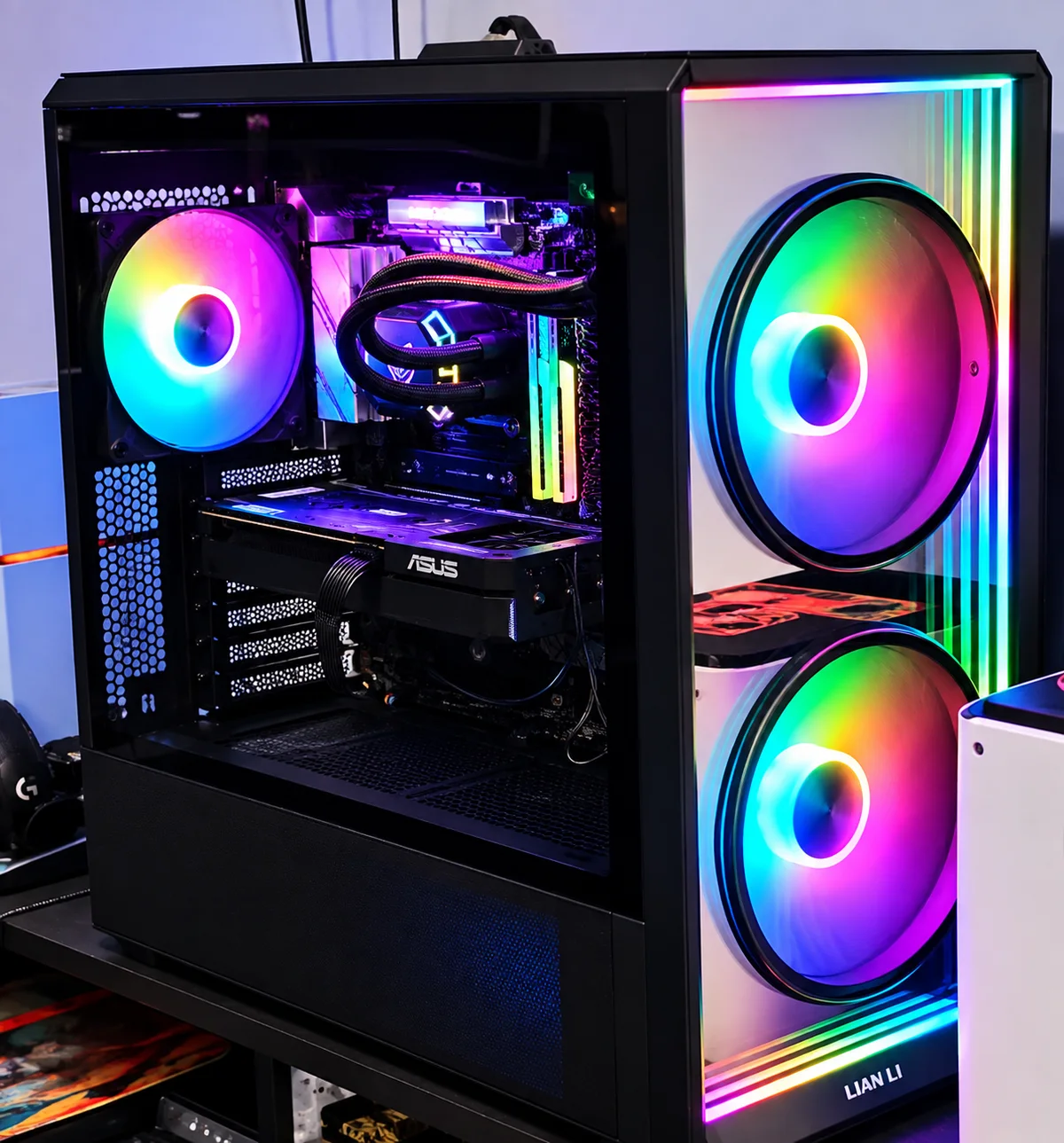 Black Lian Li PC with multicolor front fans, illuminated internal components and liquid cooling.